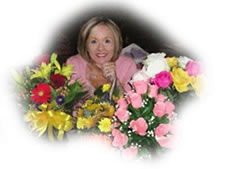 Janice Mortlock surrounded by flowers